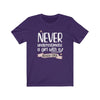 Printify T-Shirt Team Purple / S "Never Underestimate A Girl With Hockey Stick" Unisex Jersey Tee